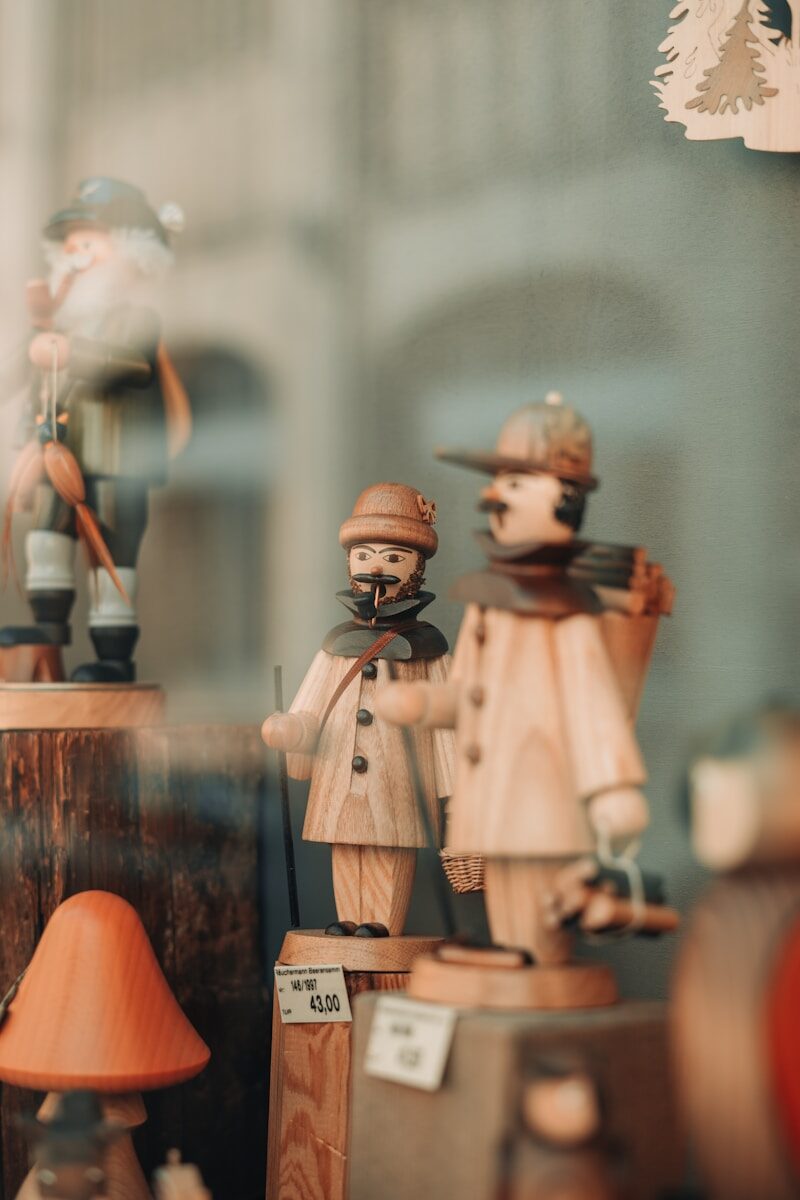 a group of wooden figurines sitting on top of a table